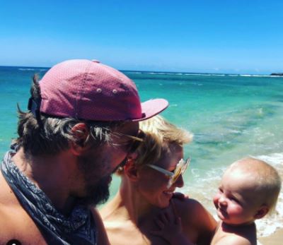 Betsy Phillips with her husband Zachary Knighton and their son Bear Analu Knighton